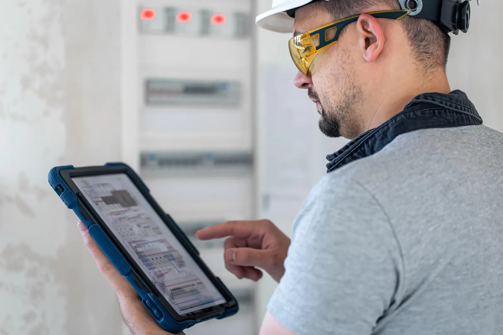 Engineer servicing a fire and security system under a maintenance contract
